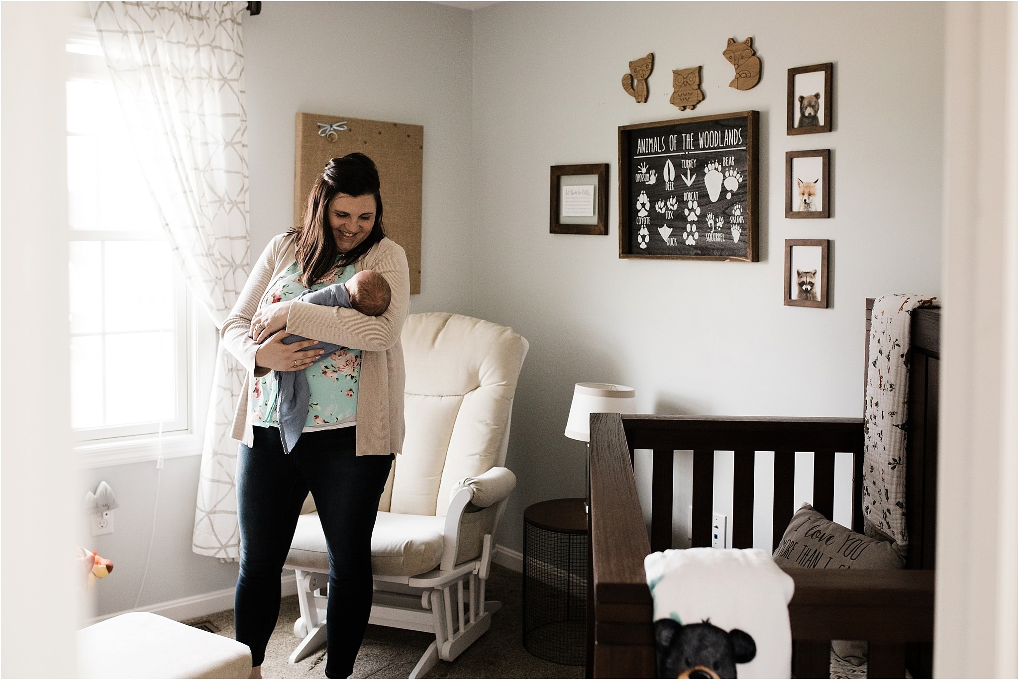 mother and newborn boy in rustic outdoor themed nursery