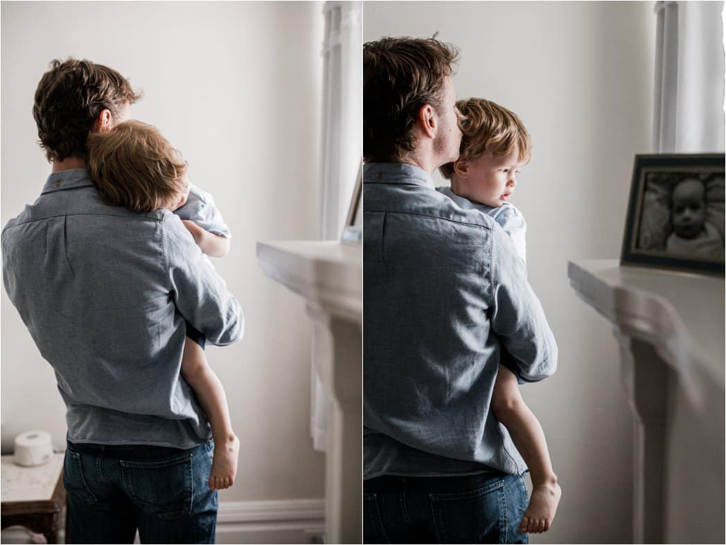 father holding toddler at family newborn session