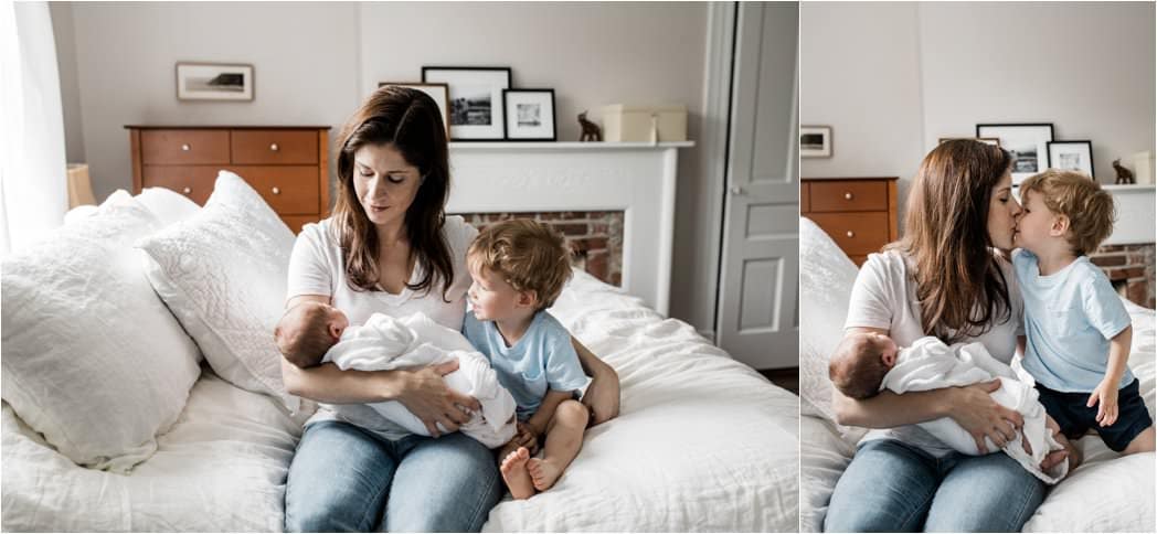 mother and big brother with newborn at home