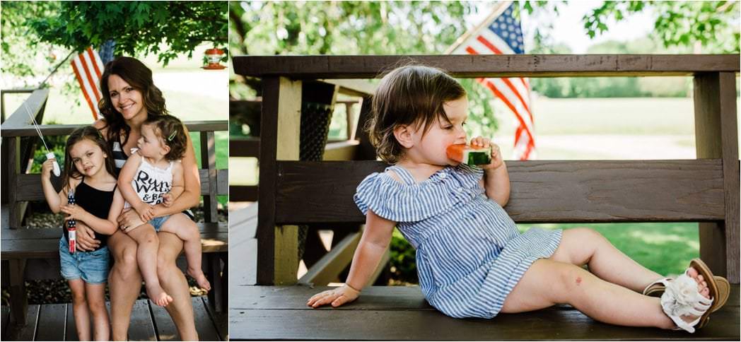 Toddler girl eating watermelon in a blue striped dress