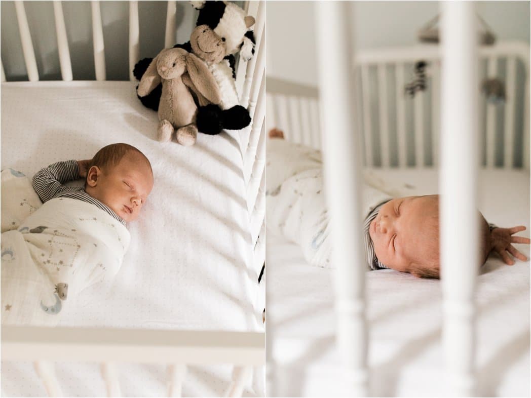 swaddled newborn baby boy in crib