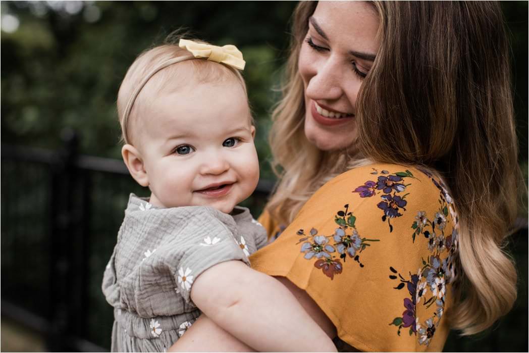 MOTHER HOLDING DAUGHTER