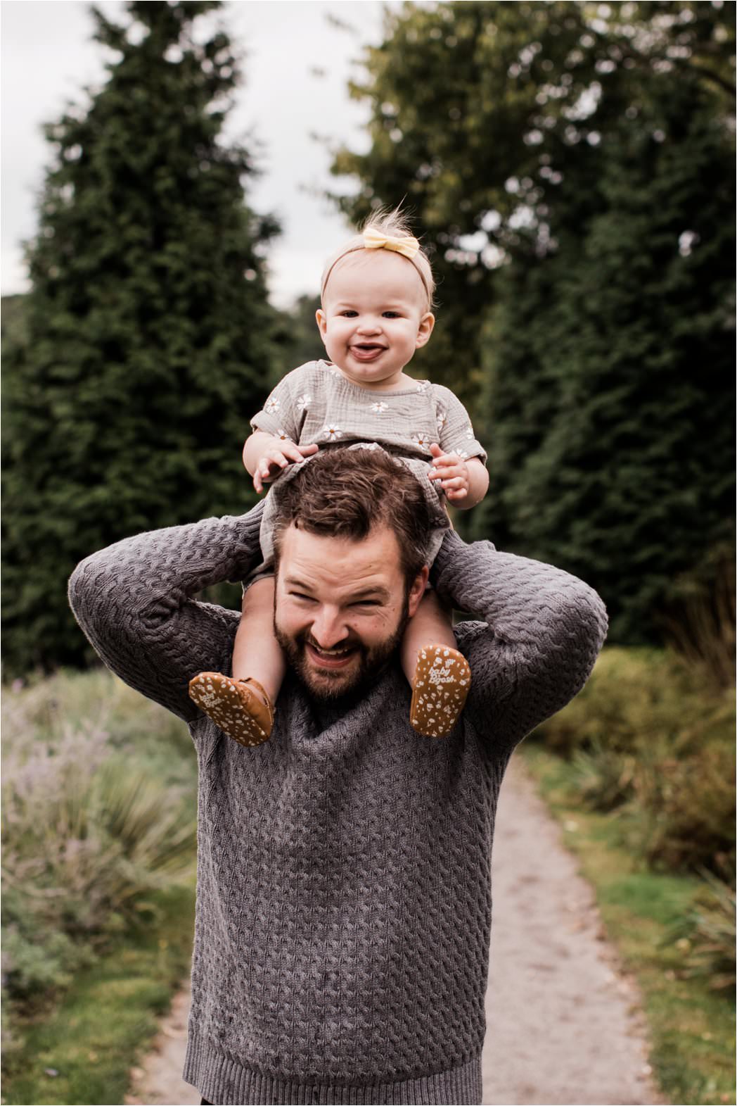 ONE YEAR OLD ON FATHERS SHOULDERS