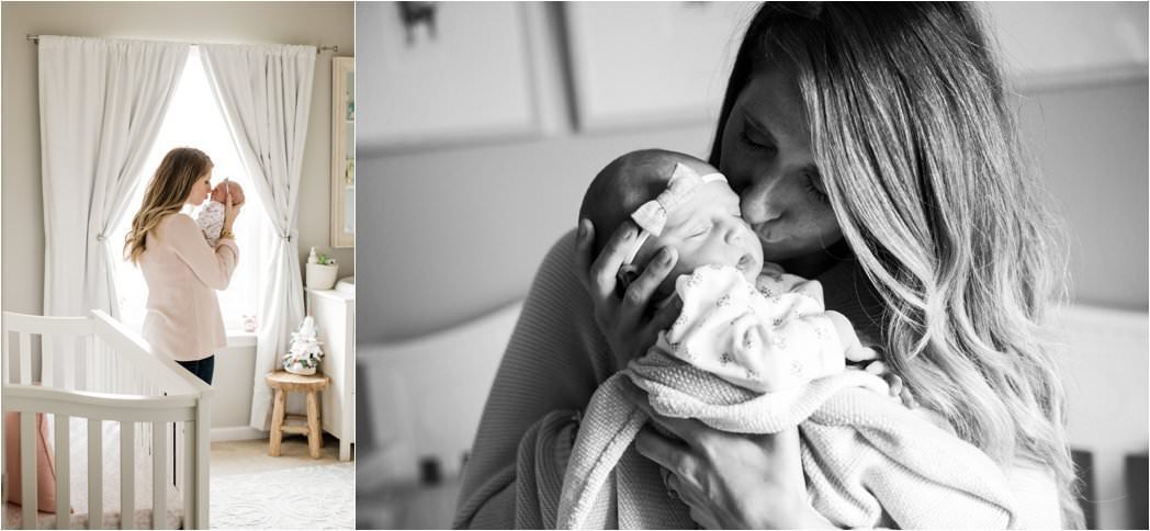 mother kissing and holding her newborn baby girl in neutral nursery