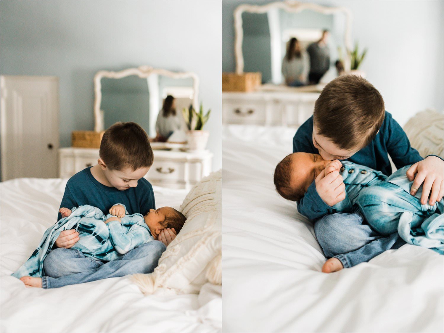 OLDEST SIBLING HOLDING NEWBORN