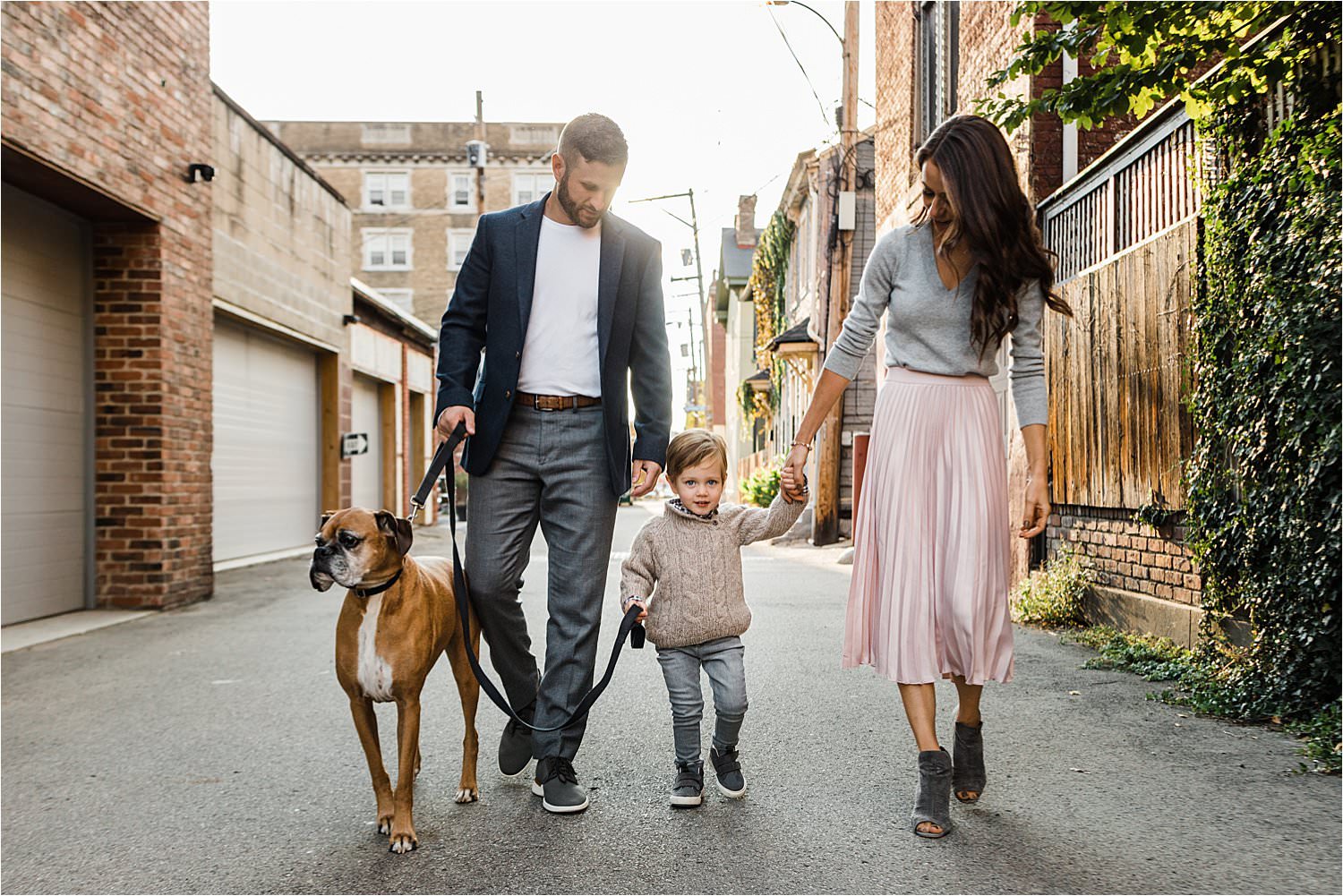 family walking dog in Pittsburgh neighborhood