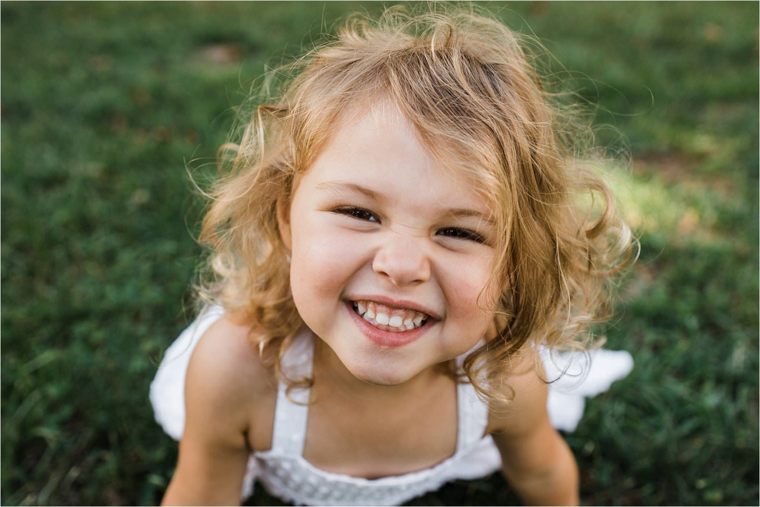 big smile on a little girl close up photo