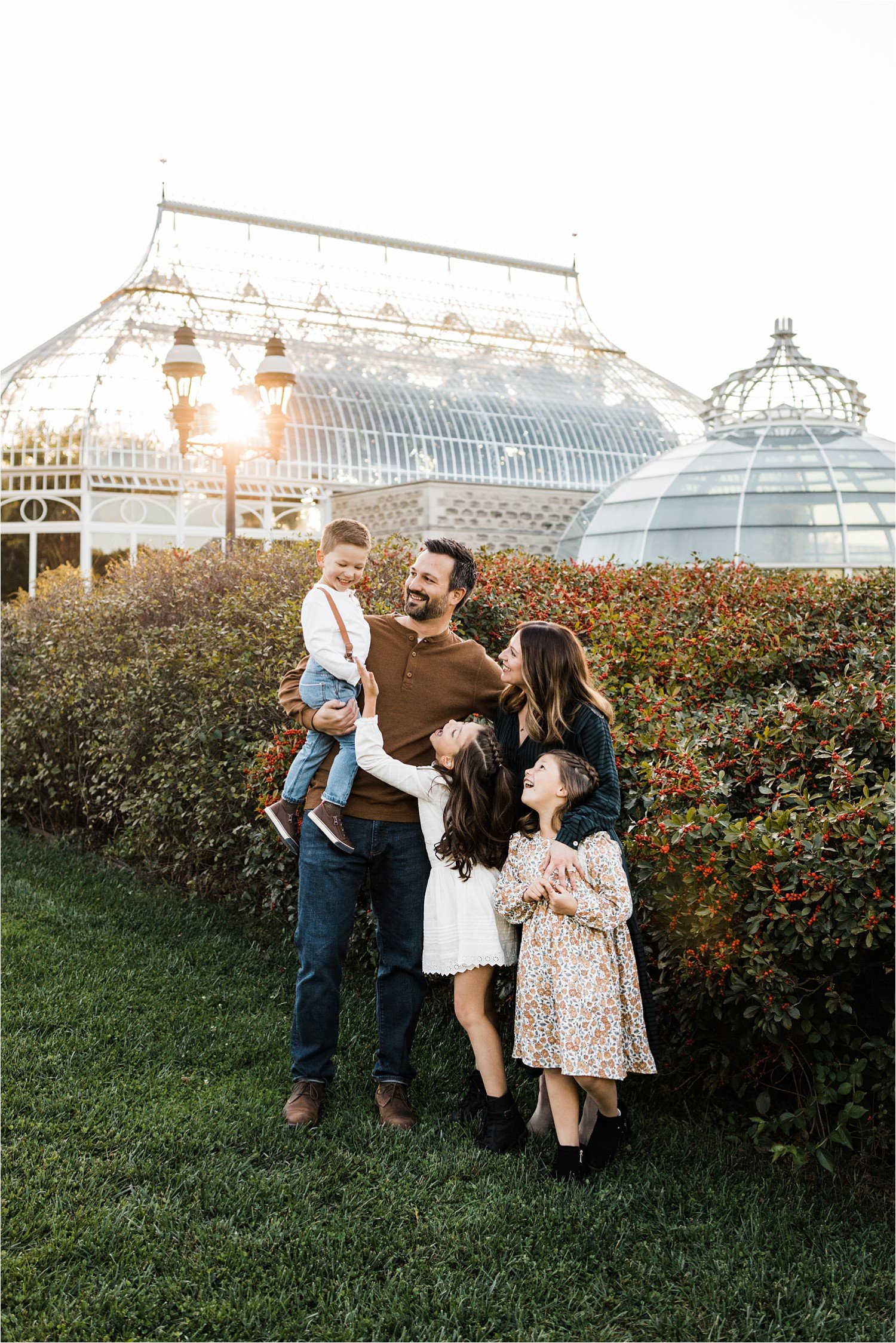 fun family photo starring the youngest child at golden hour